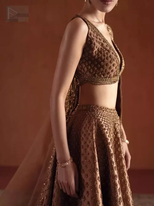 The "Boski" Glow: A close-up of the antique gold and Boski shade embroidery that gives this bridal wear its vintage