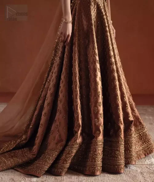 Hemline Craftsmanship: Intricate view of the heavily embellished lehenga hemline featuring Dabka, stones, and Swarovski crystals.