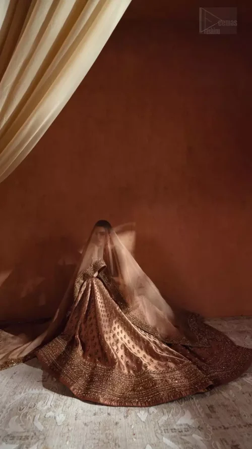 Side Profile: Side view of the bronze blouse and lehenga, highlighting the finished edges and concealed side zip fit.