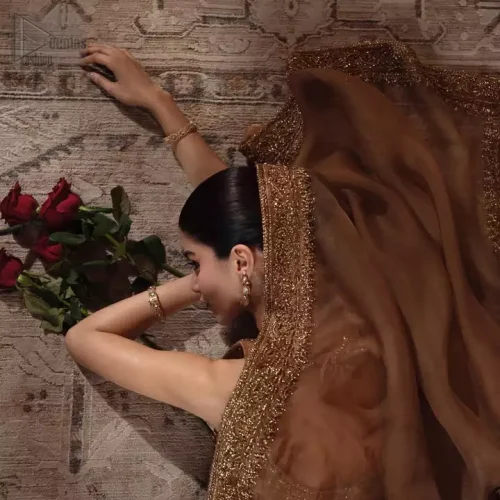 Embroidery Zoom: High-definition shot of the antique embroidery featuring pearls, sequins, and silk threads on bronze silk.