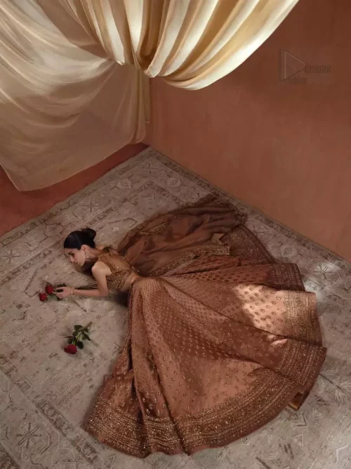 Crystal Brilliance: Macro shot of the Swarovski crystals and beads reflecting light on the bronze silk bodice.