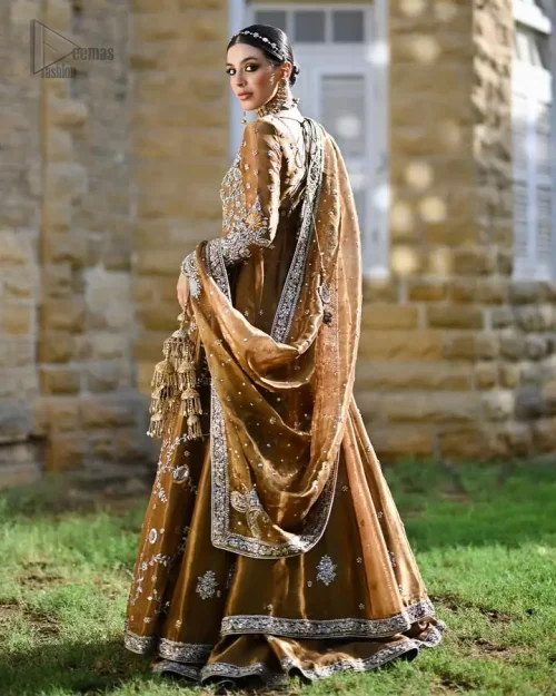 Luminous copper maxi layered with an airy lehenga and embellished dupatta, a celebration in motion