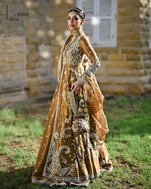 Statement copper outfit with flowing silhouette and detailed craftsmanship, festive grandeur defined