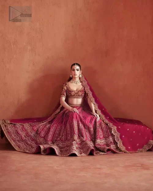Complete Reception Look: Model view of the Crimson Lehenga set, styled as a favorite choice for first-day wedding celebrations.