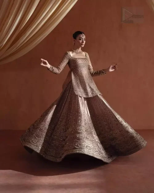 Complete Reception Look: Model view of the Golden Short Shirt Lehenga set, the perfect choice for a first-day wedding celebration.