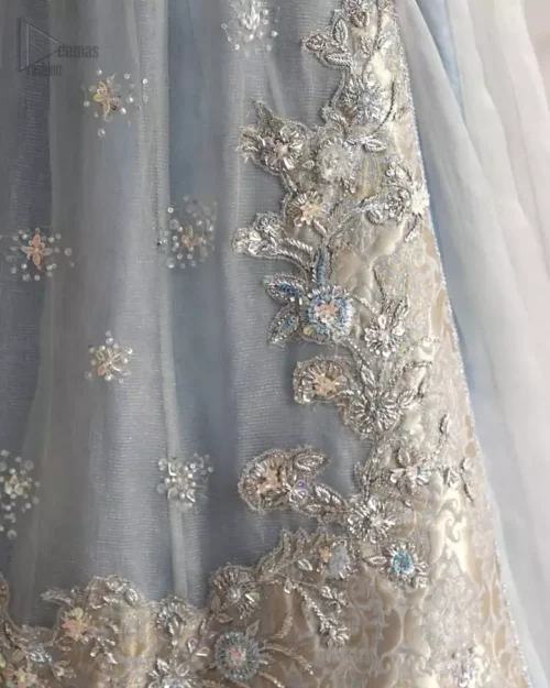 Ice blue layered outfit with sequined dupatta and delicately crafted embroidery accents