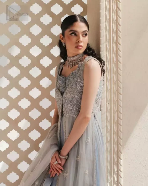 Statement occasion wear with a fluid gown overlay and intricately embellished inner dress