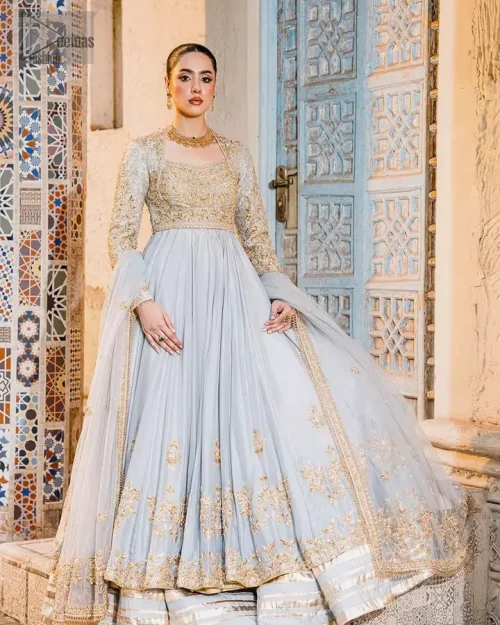 Ice blue pishwas lehenga with golden embroidery, square neckline and full sleeves for Walima wear