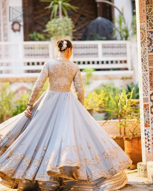Elegant ice blue bridal pishwas with antique gold dabka, pearls and Swarovski crystal detailing