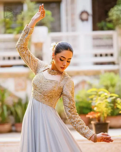 Flowing ice blue lehenga set with lace borders and fixed waist belt, paired with misty organza dupatta