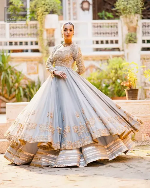 Royal ice blue wedding outfit featuring square neck pishwas and intricate golden thread embroidery