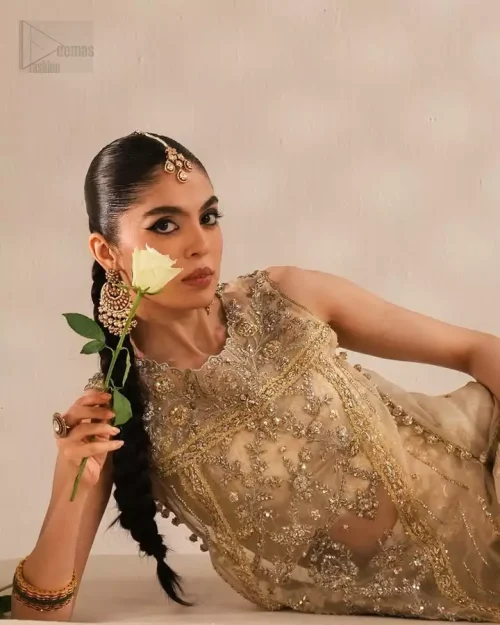 Ivory organza shirt adorned with silver-gold embroidery paired with a majestic jamawar sharara