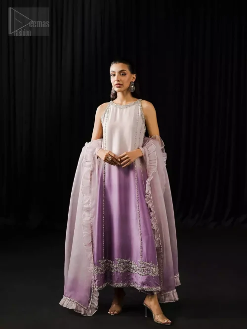 Lavender and mauve A-line shirt with halterneck and silver embroidery, paired with pure silk trousers and organza dupatta.