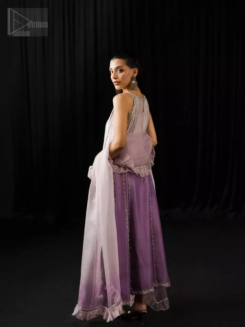 Modern party wear in lavender and mauve with silver embroidered silk shirt, tailored trousers, and ruffled organza dupatta.