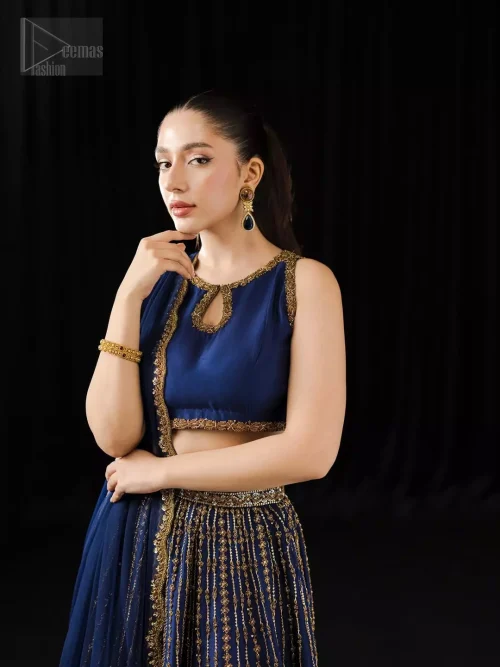 Together, they soften the boldness with a celestial charm. This ensemble bridges tradition and allure, and is perfect for mehndi