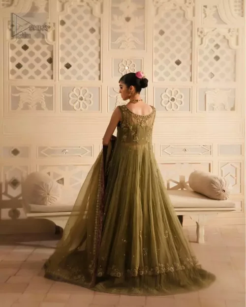 Sleeveless silhouette with a contemporary side-open cut, balancing modern edge with tradition.