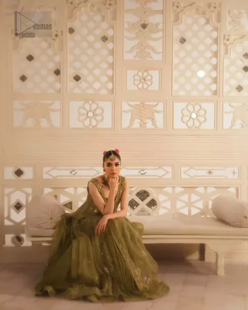 Zari net gown drapes effortlessly, offering a light yet structured couture finish.