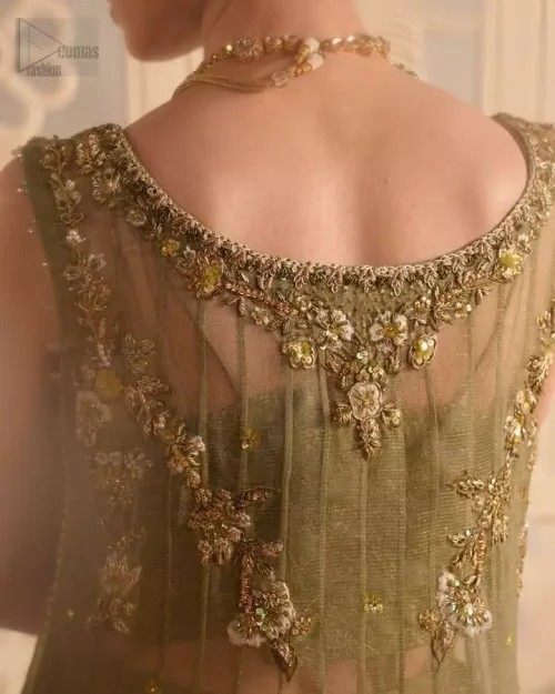 Fine dabka, sequins, pearls, and Swarovski accents create a soft, luminous surface detail.