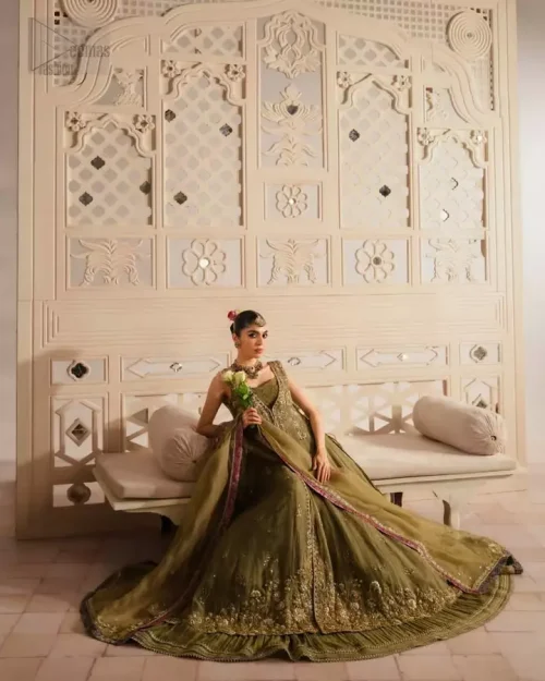 Net dupatta with subtle sequins spray completes the ensemble with understated shimmer.