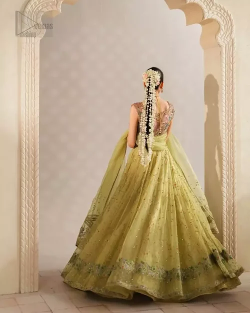 Sleeveless Silhouette: Focus on the sleeveless design and perfectly finished edges of the pink tissue blouse, tailored for a modern