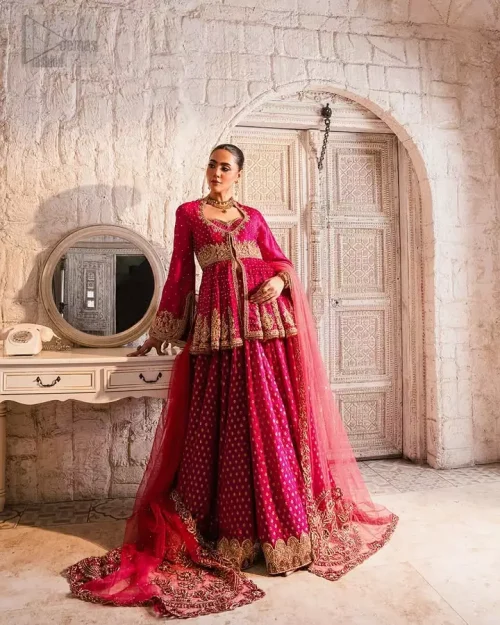 Peplum Detail: Close-up of the front-open peplum design in raspberry raw silk, showcasing the unique structural elegance of the top.