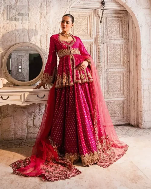 Net Dupatta Focus: Raspberry net dupatta featuring a delicate sequins spray and hand-embellished borders for a regal finish.
