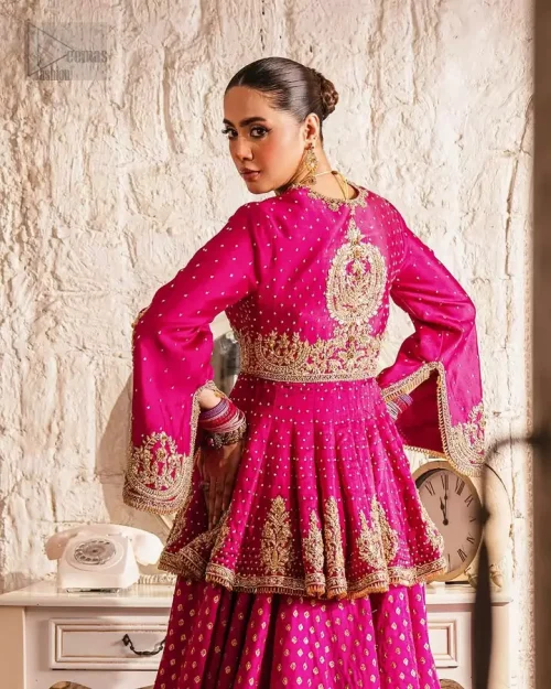 Bell Sleeve Craftsmanship: Detailed shot of the graceful bell sleeves featuring fuchsia and shocking pink silk thread accents.