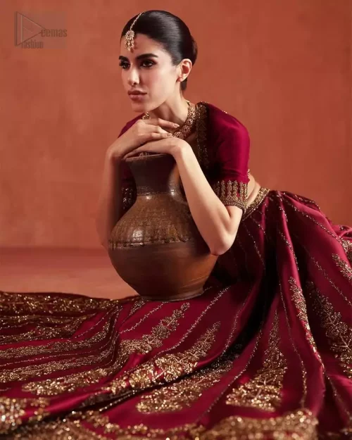 Sleeve Detail: A detailed shot of the half-sleeves on the pure silk blouse, adorned with delicate hand-crafted motifs.