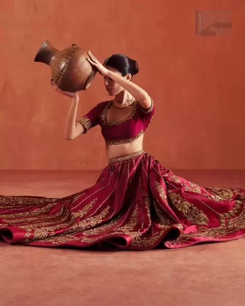Side Profile: Side view of the ruby red blouse choli, highlighting the concealed zip and tailored fit.
