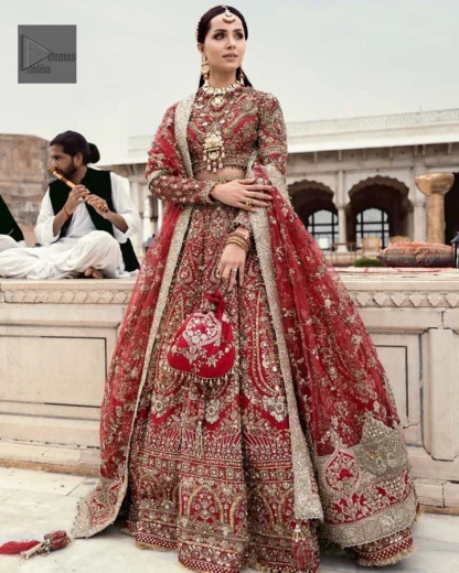 Make your day bright and bold! Deemas Fashion presents a beautiful red outfit which involves silver embroidery and is covered with tilla, dabka, kora, Kundan and the beautiful details of Zardozi. The full sleeves are covered with attractive floral patterns. Further, the jewel neckline gives a romantic touch to this beautiful outfit. The?Bridal Lehenga?has a massive flare and it gives the gorgeous bride a breathtaking look on the big day.?The Lehenga is gracefully emblazoned with?sequins, crystals, and Resham. Intricate details of zardozi and gota make this Lehenga Dress an epitome of grace. A beautiful dupatta with floral patterns & beautiful embellished border completes the look. Top: Blouse Colour: Red Fabric: Organza Fully Embellished Jewel Neckline Silver Embroidery Full-Length Sleeves Floral Patterns Concealed With Side Zip Finished Edges Bottom: Lehenga Colour: Red Fabric: Organza Fully Embellished Flared Finished Edges Fixed Waist Belt With Side Zip Closure Dupatta: Colour: Red Fabric: Net Floral Patterns Dupatta Having Four Sides Embellished Border Finished Edges Embellishment : Work includes kora, dabka, stones, sequins, beads, silk threads and Swarovski crystals. 100% pure highest quality imported fabric.