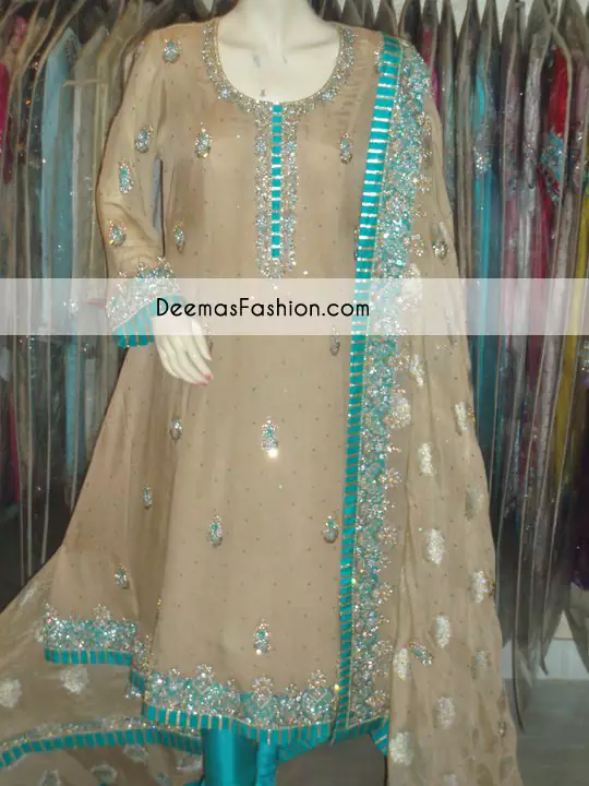 Light brown pure crinkle chiffon shirt has been adorned embellished neckline. This party wear shirt comes with churidar pajama. Pure banarsi jamawar chiffon dupatta has been embellished with a work border on the head side (single side also called matha patti).